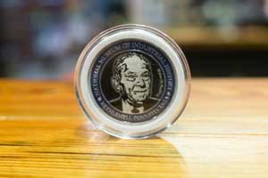 Coin with Walter Snelling's image.