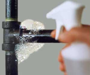 Soapy bubbles showing a leak on a pipe.