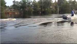 Image of a 250 gallon tank being towed through the South Carolina flood