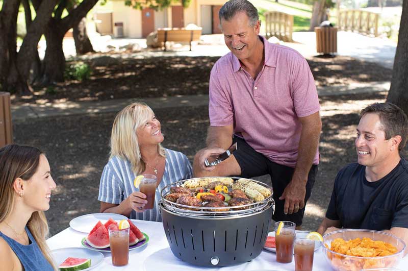 Family grilling in the park.