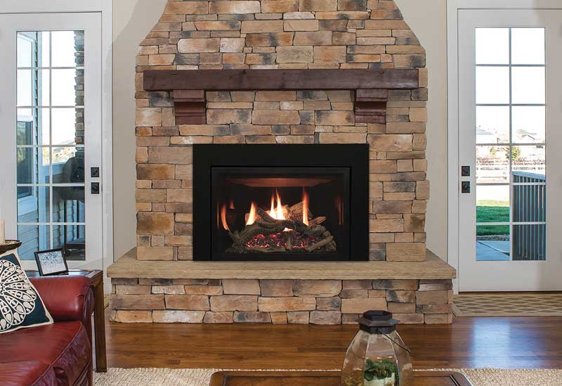 Rushmore direct-vent fireplace insert in a stone fireplace.