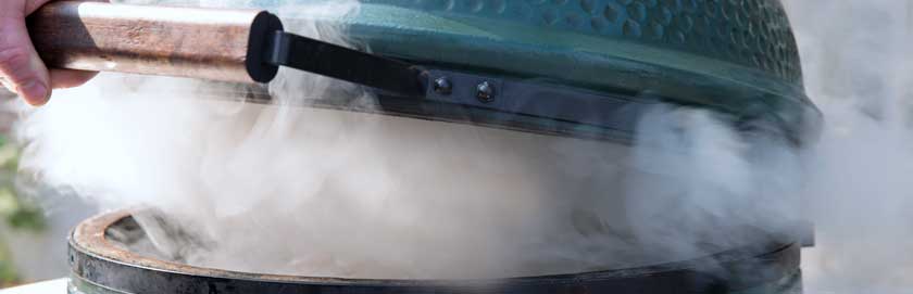 Big Green Egg billowing smoke.